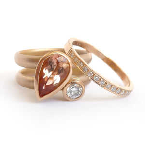 Contemporary rose gold and pear shaped imperial topaz stacking interlocking ring set.