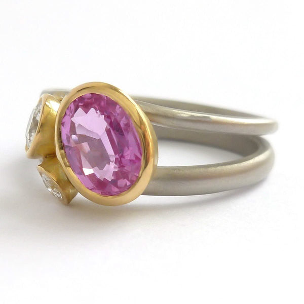 Platinum, 18ct gold, pink sapphire and two white diamonds ring. Contemporary, modern and unique.