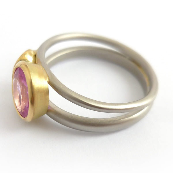 Platinum, 18ct gold, pink sapphire and two white diamonds ring. Contemporary, modern and unique.
