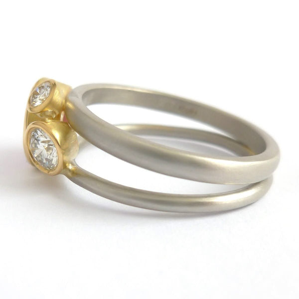 Platinum, 18ct gold, pink sapphire and two white diamonds ring. Contemporary, modern and unique.