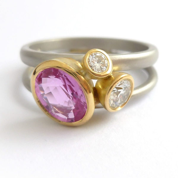 Platinum, 18ct gold, pink sapphire and two white diamonds ring. Contemporary, modern and unique.