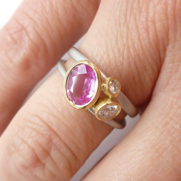 Platinum, 18ct gold, pink sapphire and two white diamonds ring. Contemporary, modern and unique.