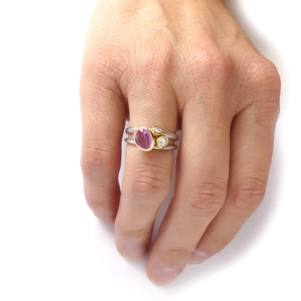 Platinum, 18ct gold, pink sapphire and two white diamonds ring. Contemporary, modern and unique.