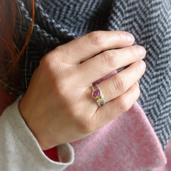 Platinum, 18ct gold, pink sapphire and two white diamonds ring. Contemporary, modern and unique.