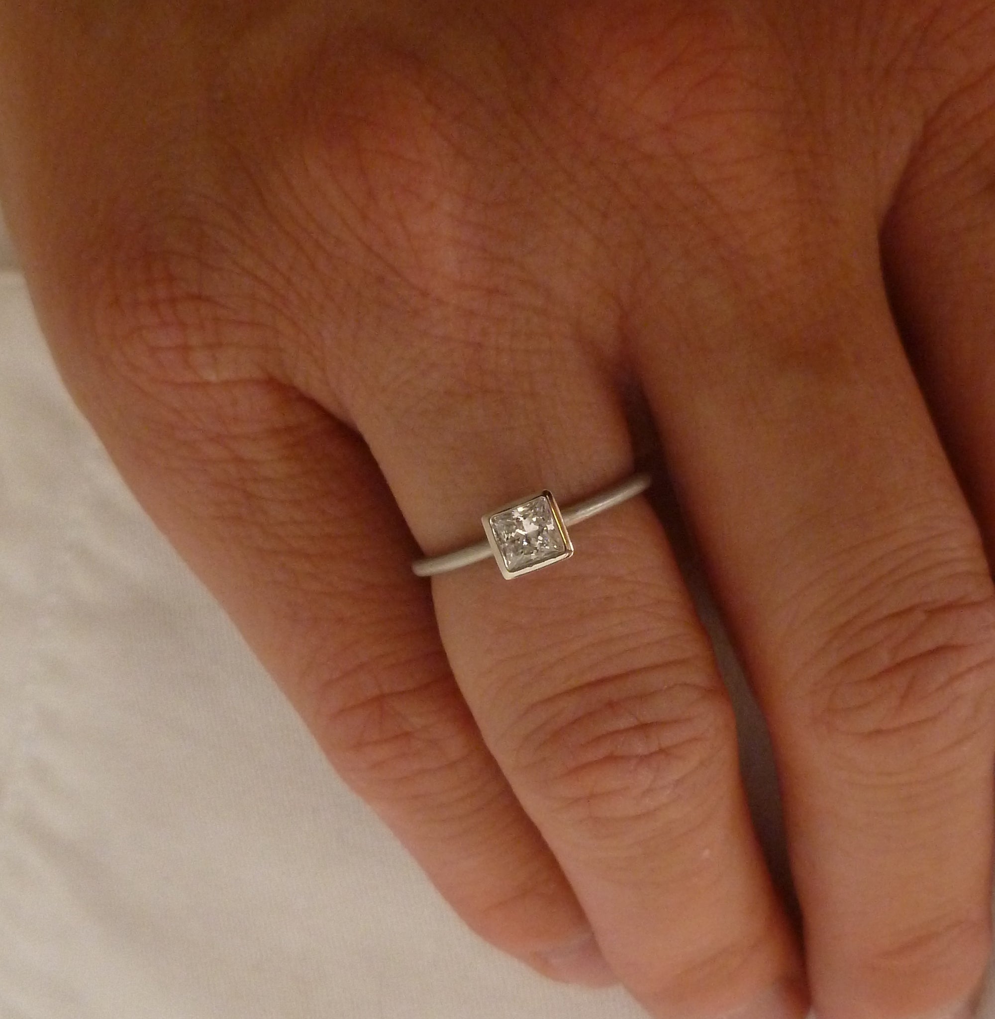 Platinum and square diamond engagement ring