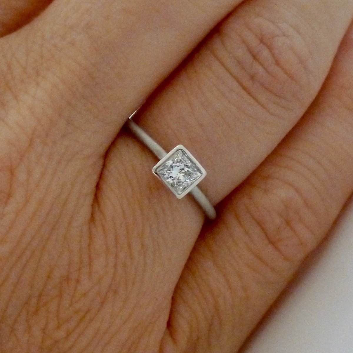 Platinum and square diamond engagement ring