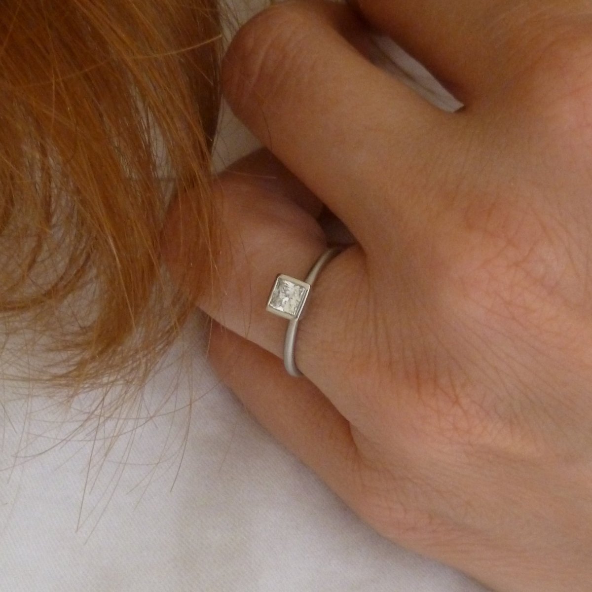 Platinum and square diamond engagement ring