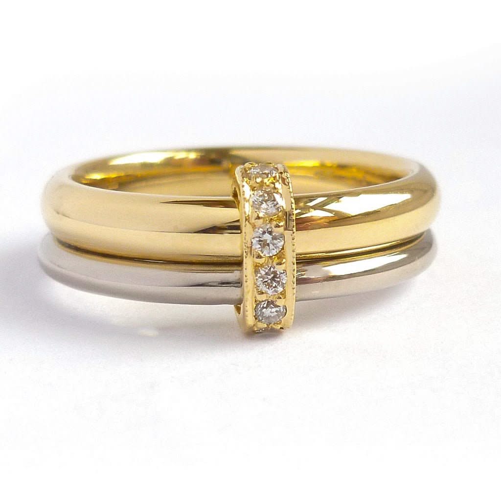 Two band 18ct yellow and white gold ring with diamonds. Contemporary, modern. Multi band ring or interlocking ring, sometimes called double band ring too.