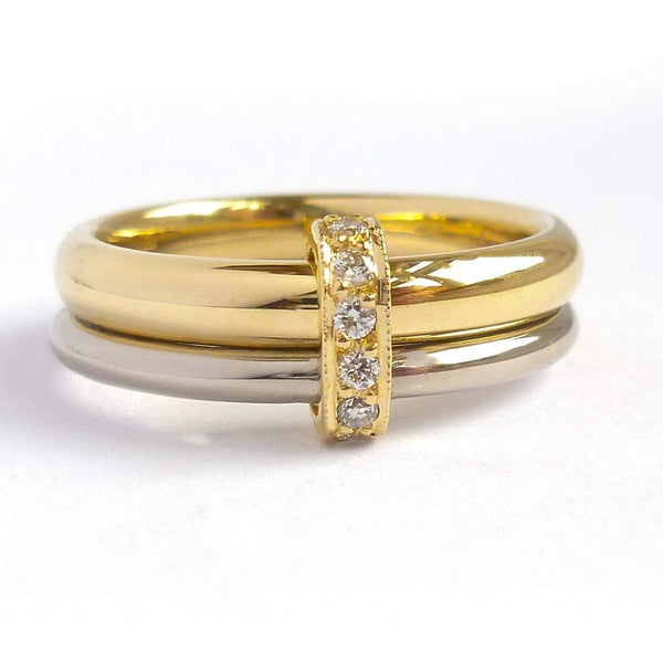 Two band 18ct yellow and white gold ring with diamonds. Contemporary, modern. Multi band ring or interlocking ring, sometimes called double band ring too.