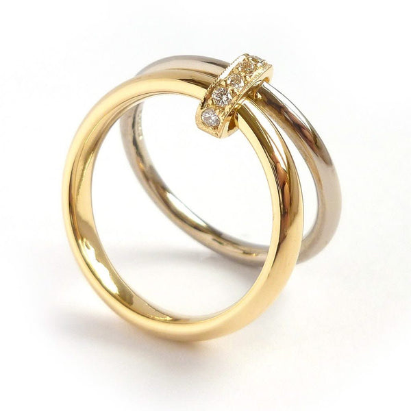Two band 18ct yellow and white gold ring with diamonds. Contemporary, modern. Multi band ring or interlocking ring, sometimes called double band ring too.