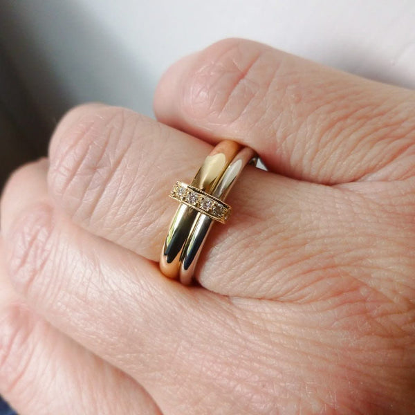 Two band 18ct yellow and white gold ring with diamonds. Contemporary, modern. Multi band ring or interlocking ring, sometimes called double band ring too.
