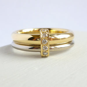 Two band 18ct yellow and white gold ring with diamonds. Contemporary, modern. Multi band ring or interlocking ring, sometimes called double band ring too.