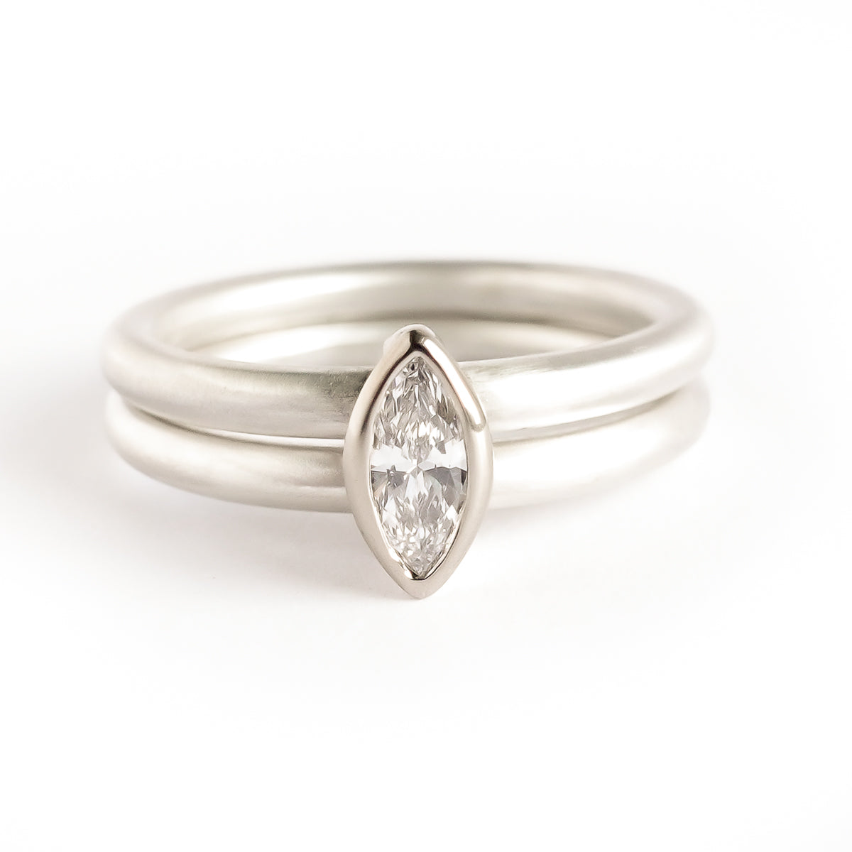 Contemporary unique and modern two band silver and gold marquise diamond stacking ring handmade Sue Lane jewellery. Perfect wedding and engagement ring.