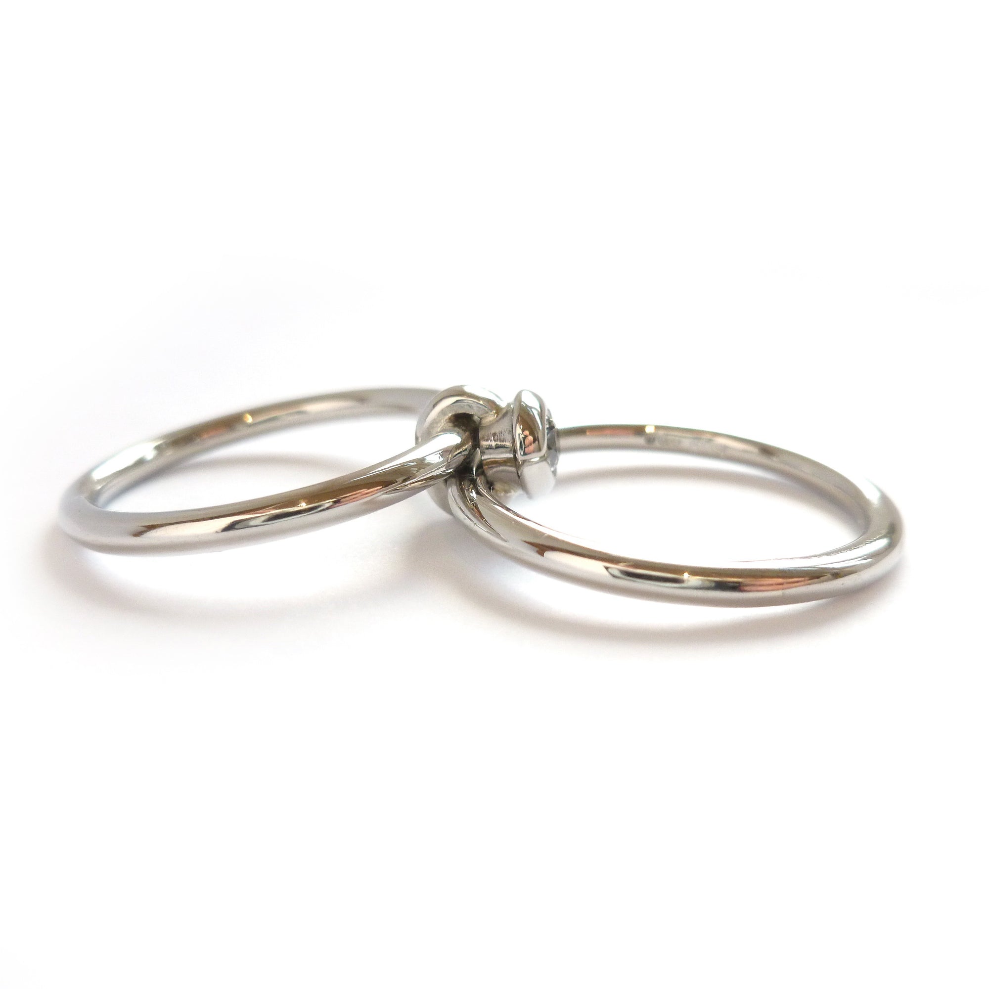 Contemporary platinum two band engagement ring with diamond. Bespoke. Multi band ring or interlocking ring, sometimes called double band ring too.