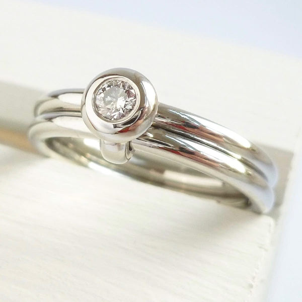 Contemporary platinum two band engagement ring with diamond. Bespoke. Multi band ring or interlocking ring, sometimes called double band ring too.