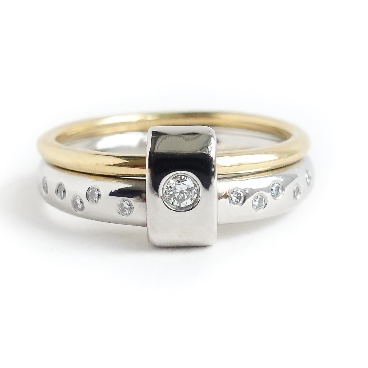 Contemporary platinum and 18ct yellow gold two band ring with diamonds