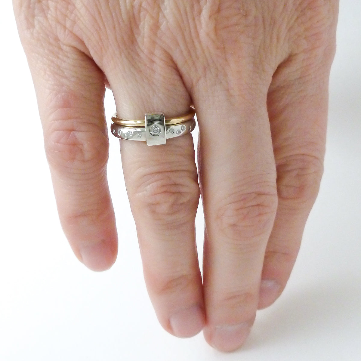 Contemporary platinum and 18ct yellow gold two band ring with diamonds