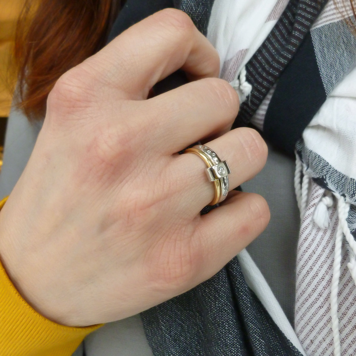 Contemporary platinum and 18ct yellow gold two band ring with diamonds