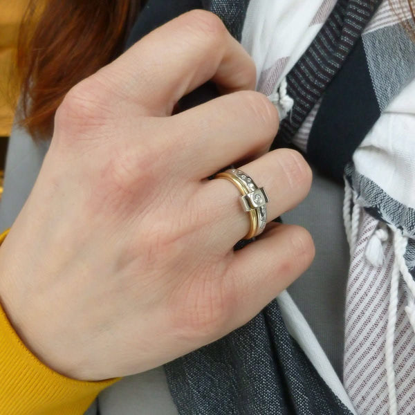 Contemporary platinum and 18ct yellow gold two band ring with diamonds