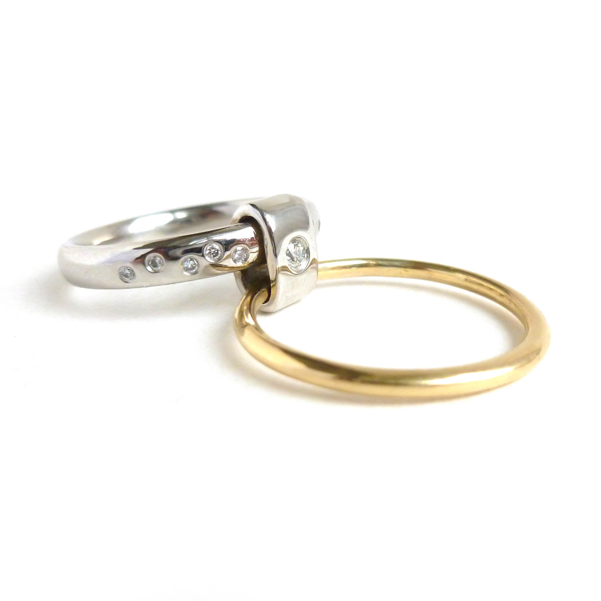 Contemporary platinum and 18ct yellow gold two band ring with diamonds