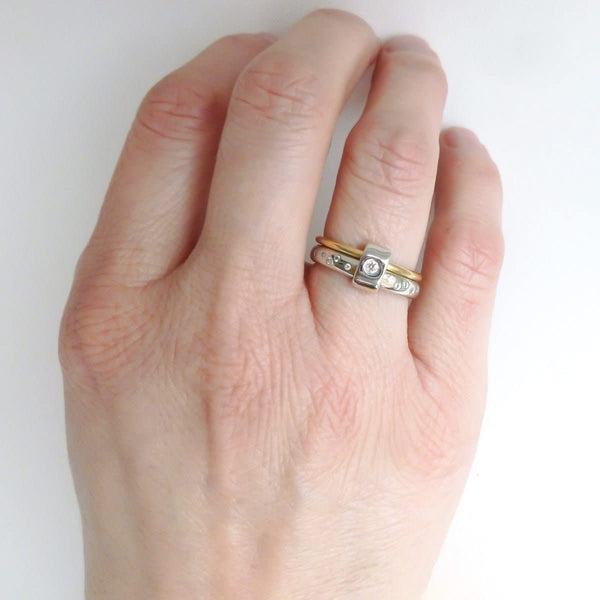 Contemporary platinum and 18ct yellow gold two band ring with diamonds