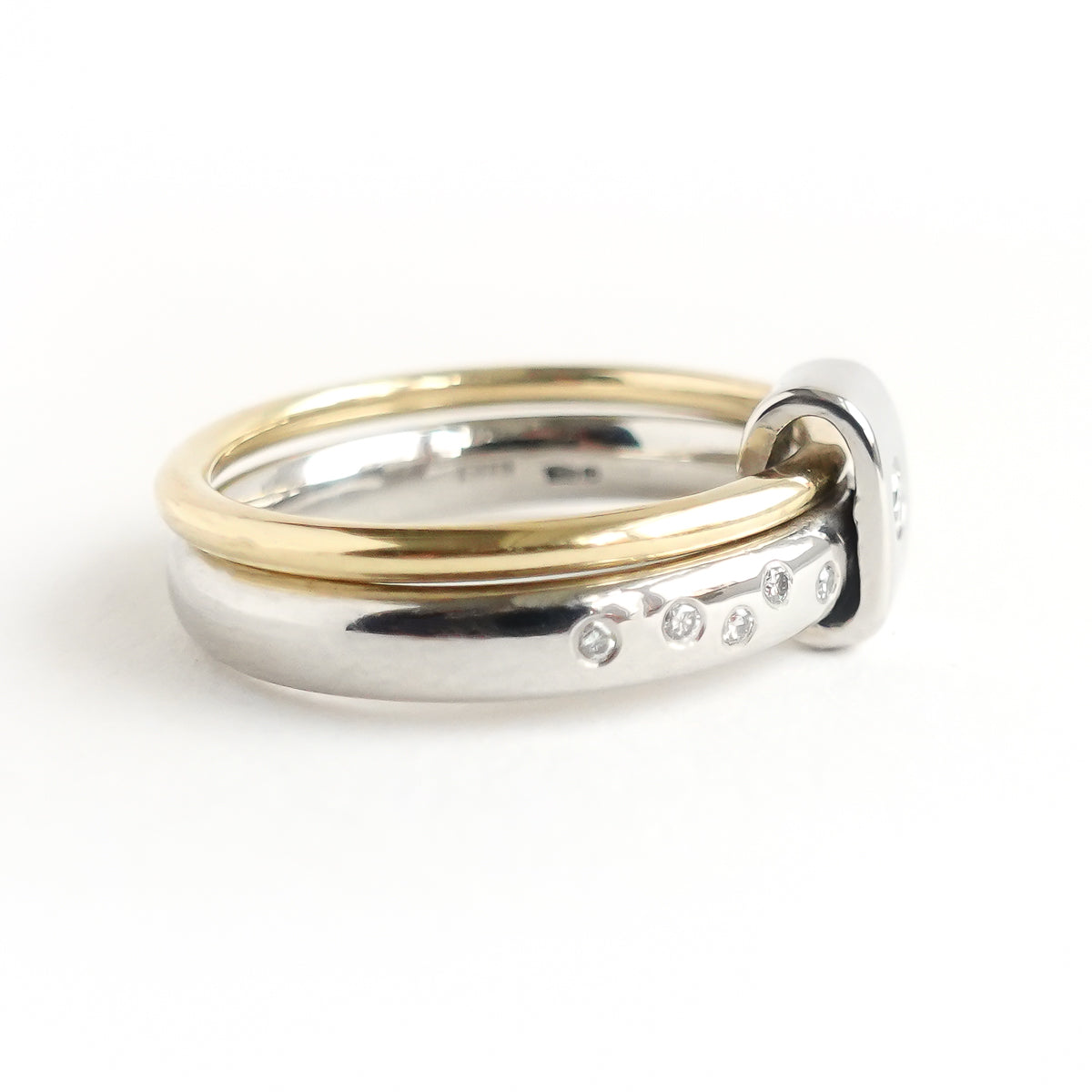 Contemporary platinum and 18ct yellow gold two band ring with diamonds