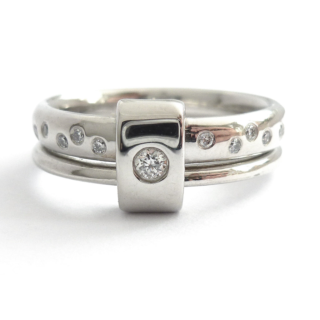 Platinum and diamond two band ring - modern, unique, contemporary. Multi band ring or interlocking ring, sometimes called double band ring too.