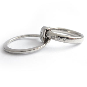 Platinum and diamond two band ring - modern, unique, contemporary. Multi band ring or interlocking ring, sometimes called double band ring too.