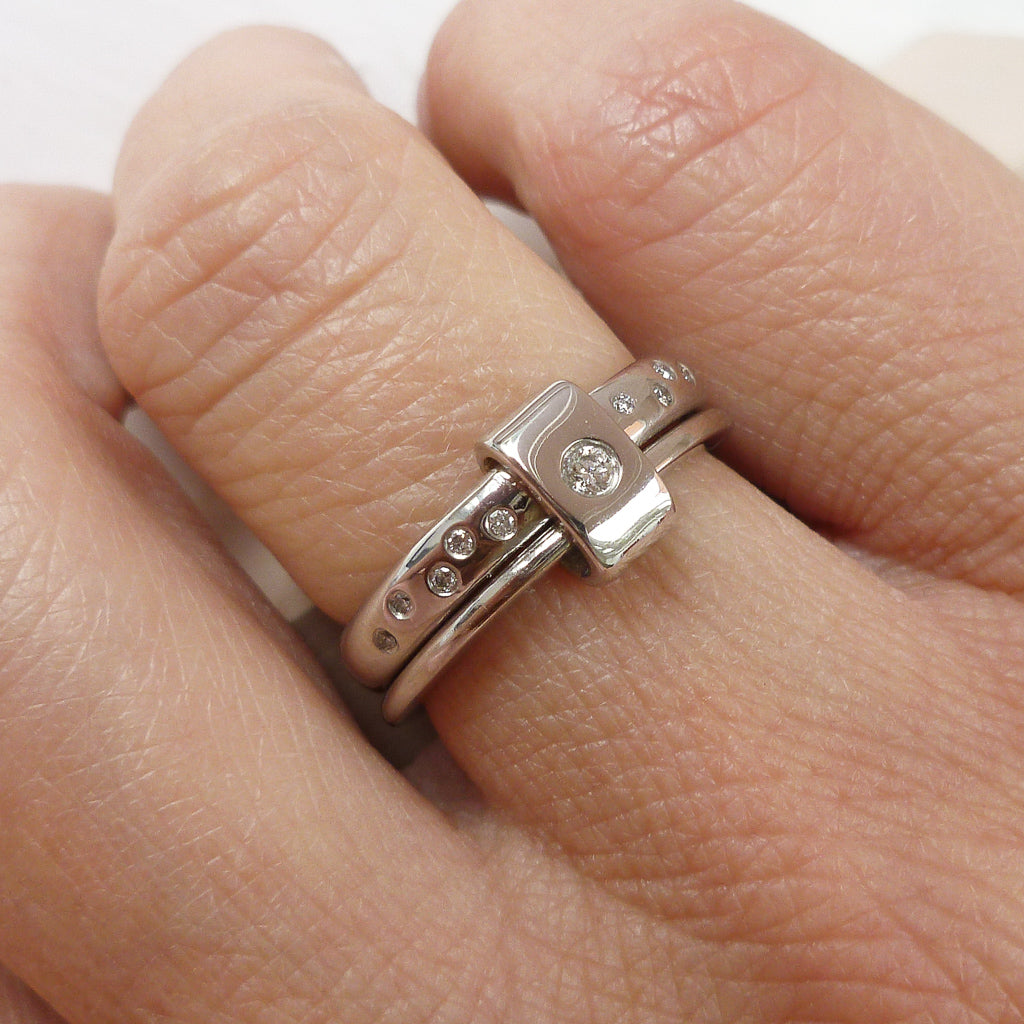 Platinum and diamond two band ring - modern, unique, contemporary. Multi band ring or interlocking ring, sometimes called double band ring too.