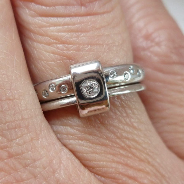 Platinum and diamond two band ring - modern, unique, contemporary. Multi band ring or interlocking ring, sometimes called double band ring too.
