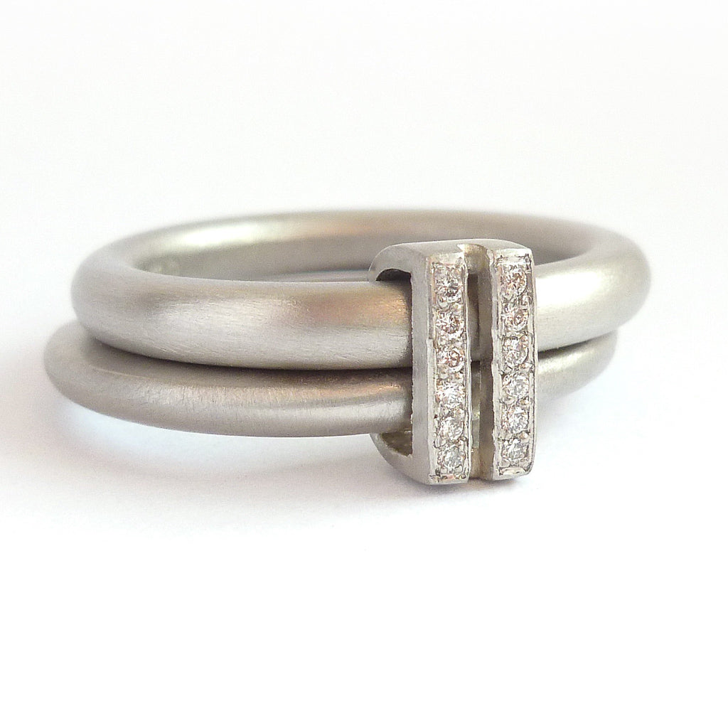 Platinum two band ring with pave set diamonds. Contemporary. By Sue Lane. Multi band ring or interlocking ring, sometimes called double band ring too.