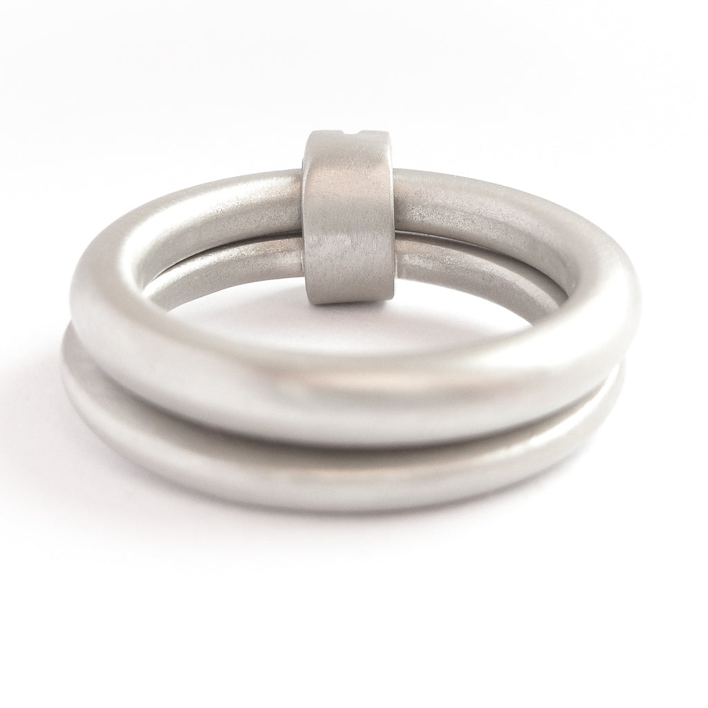 Platinum two band ring with pave set diamonds. Contemporary. By Sue Lane. Multi band ring or interlocking ring, sometimes called double band ring too.