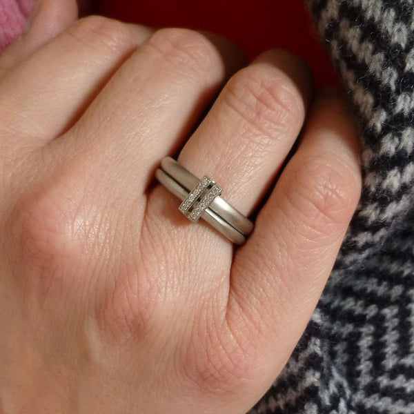 Platinum two band ring with pave set diamonds. Contemporary. By Sue Lane. Multi band ring or interlocking ring, sometimes called double band ring too.