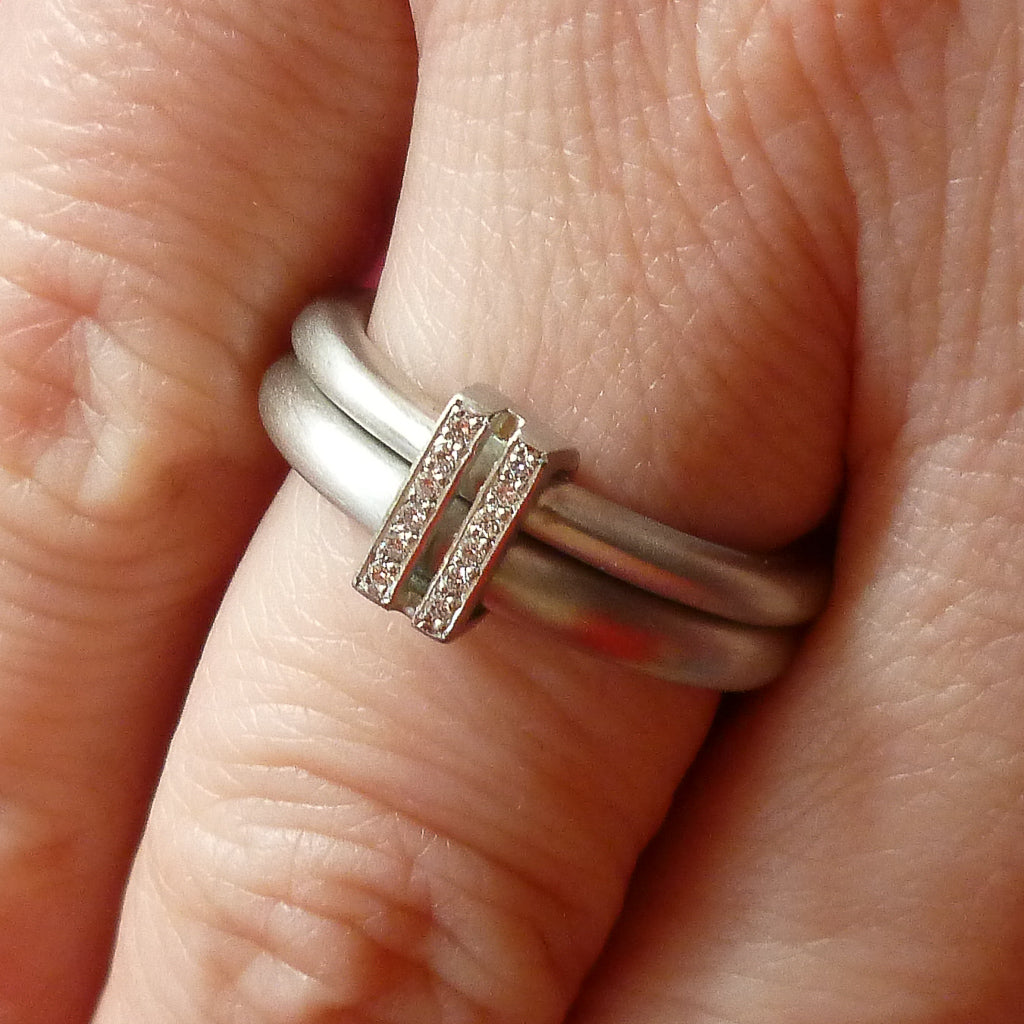Platinum two band ring with pave set diamonds. Contemporary. By Sue Lane. Multi band ring or interlocking ring, sometimes called double band ring too.