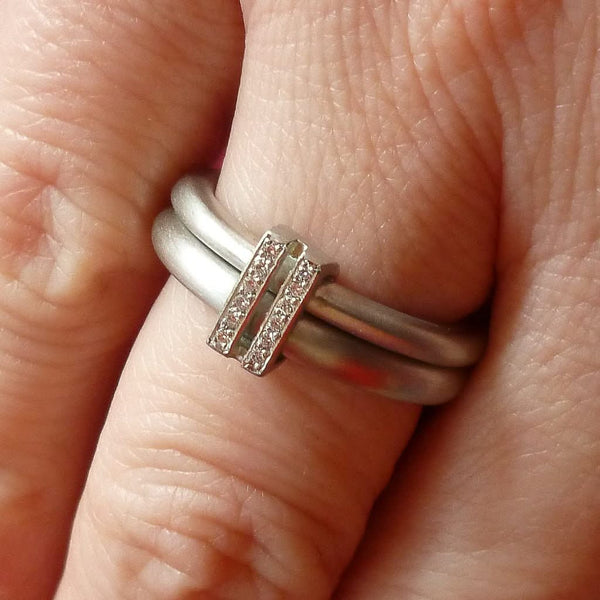 Platinum two band ring with pave set diamonds. Contemporary. By Sue Lane. Multi band ring or interlocking ring, sometimes called double band ring too.