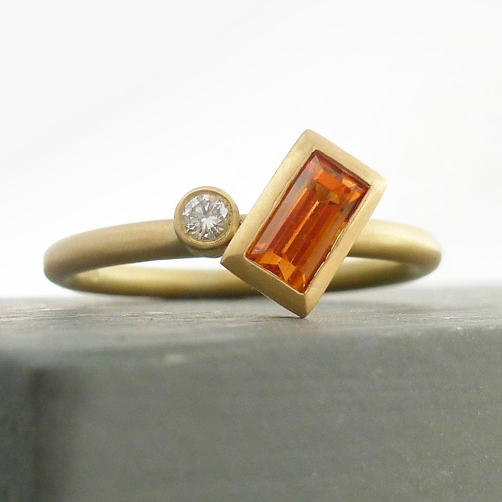 A bespoke orange sapphire and diamond 18ct gold ring. Contemporary and unique. 