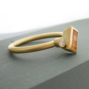 A bespoke orange sapphire and diamond 18ct gold ring. Contemporary and unique. 