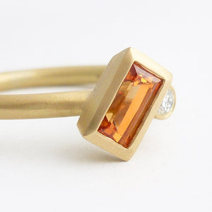 A bespoke orange sapphire and diamond 18ct gold ring. Contemporary and unique. 