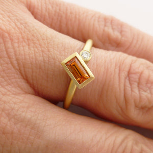 A bespoke orange sapphire and diamond 18ct gold ring. Contemporary and unique. 