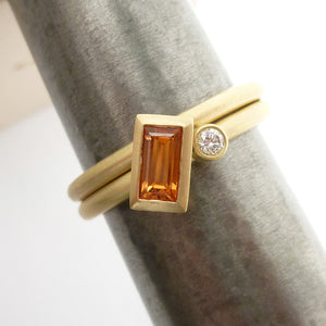 A bespoke orange sapphire and diamond 18ct gold ring. Contemporary and unique. 
