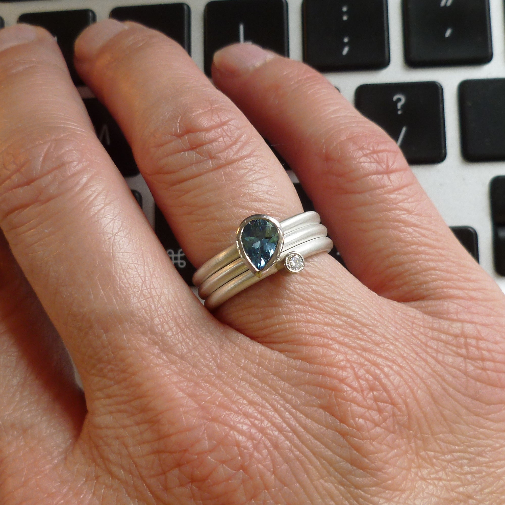 Contemporary, unique, bespoke, handmade and modern aquamarine and diamond engagement ring 