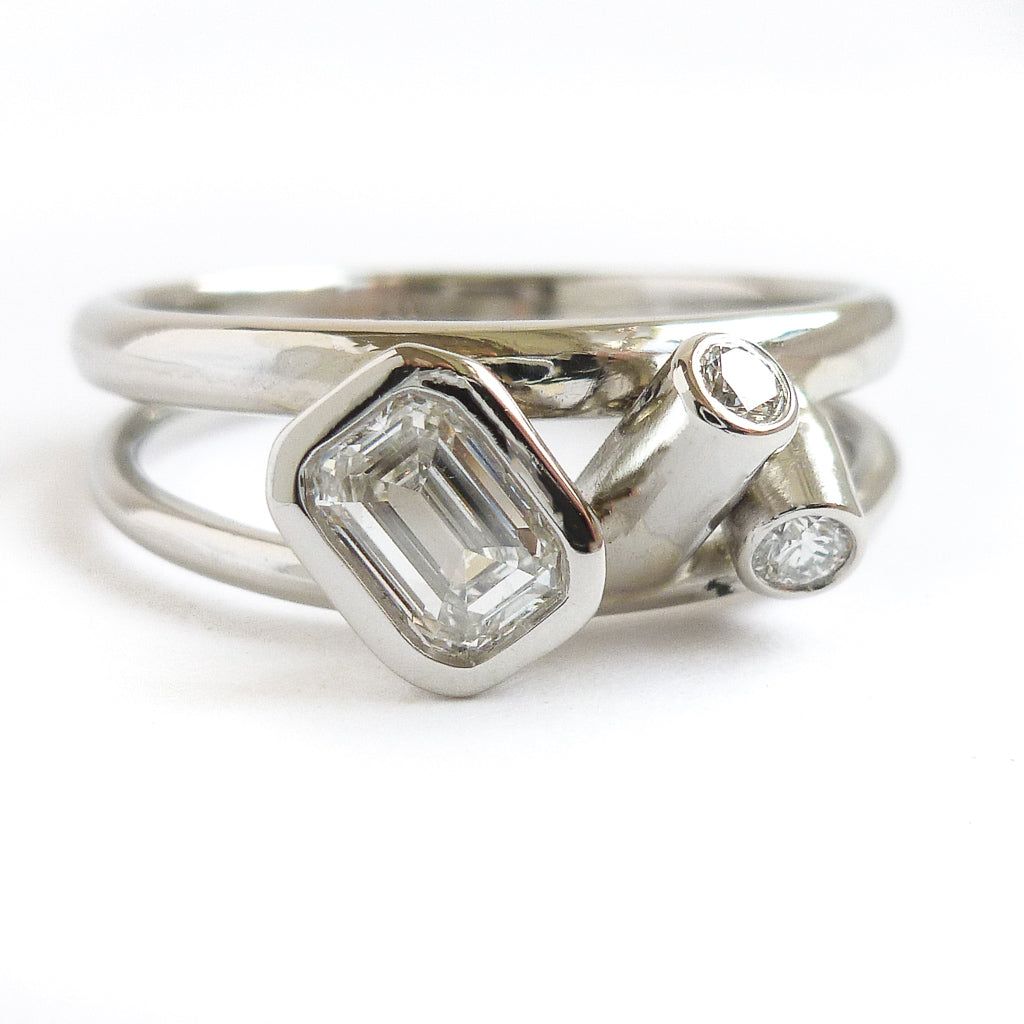 Modern two band platinum ring which can symbolise linking together in relationship