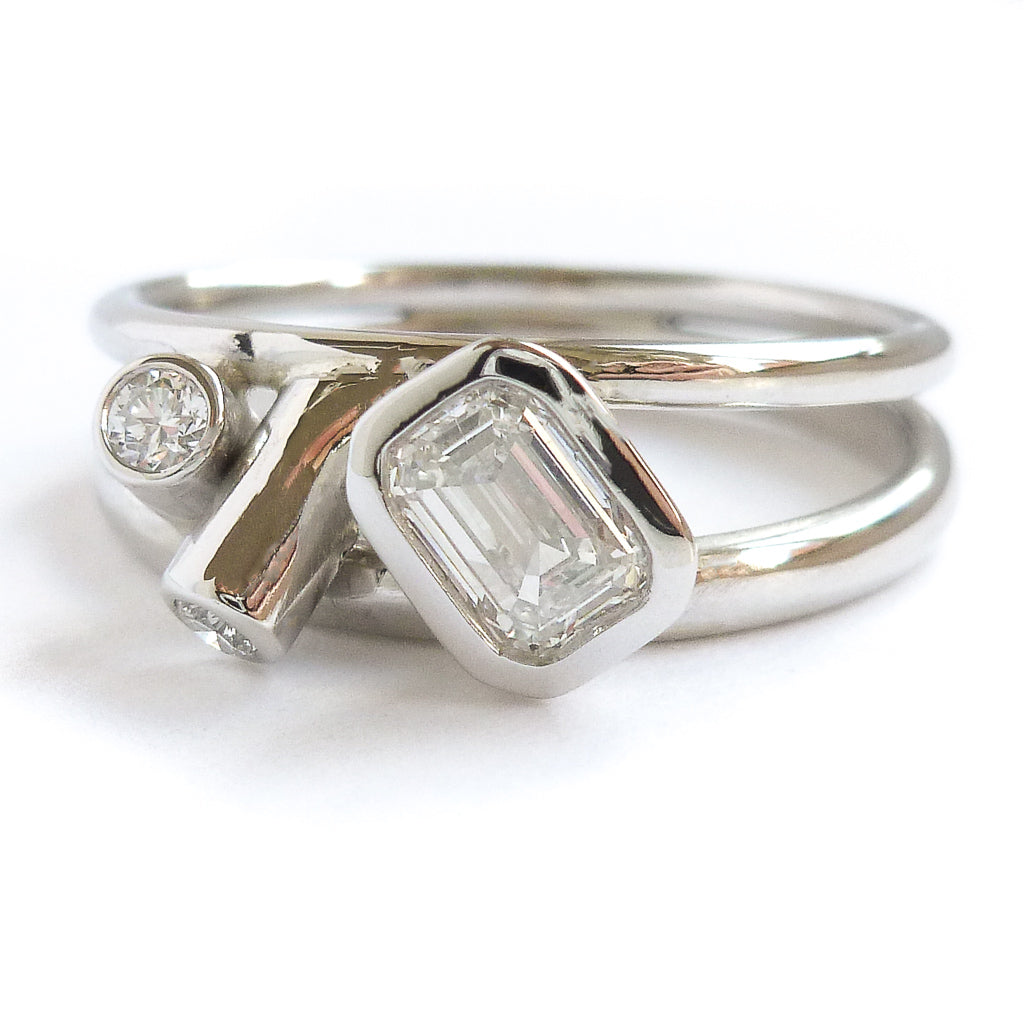 Modern two band platinum ring which can symbolise linking together in relationship