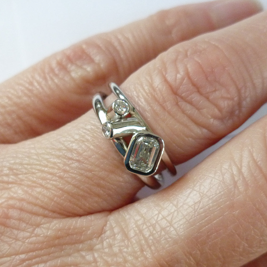 Modern two band platinum ring which can symbolise linking together in relationship