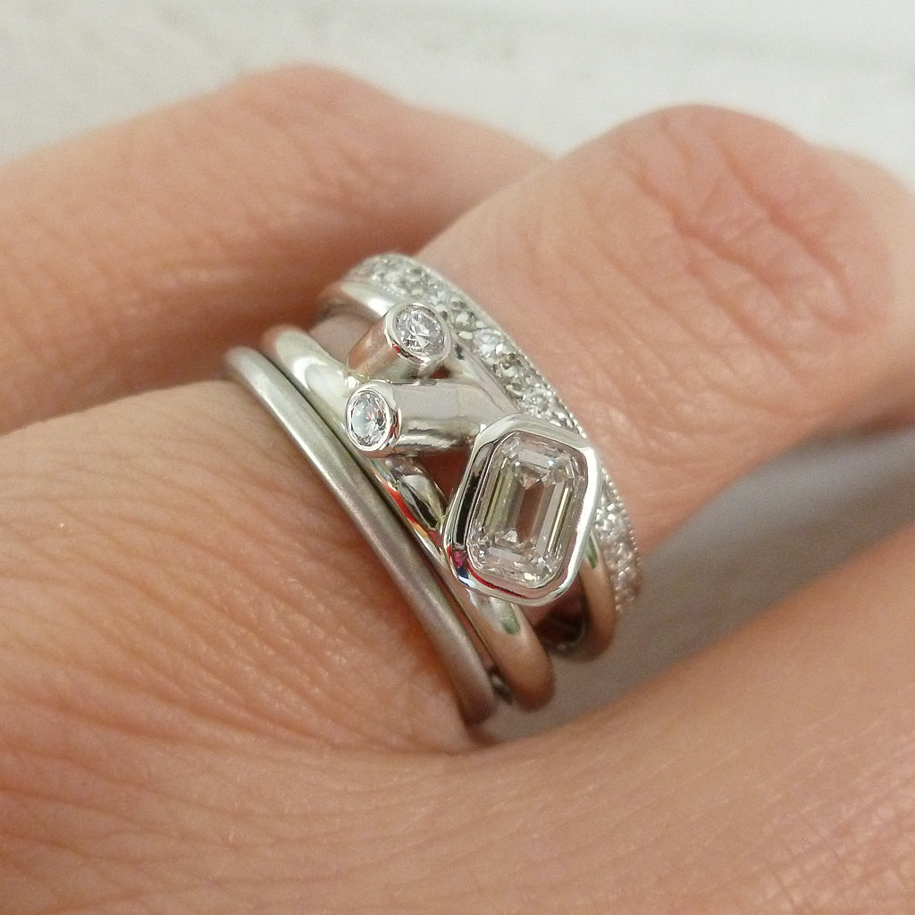 Modern two band platinum ring which can symbolise linking together in relationship