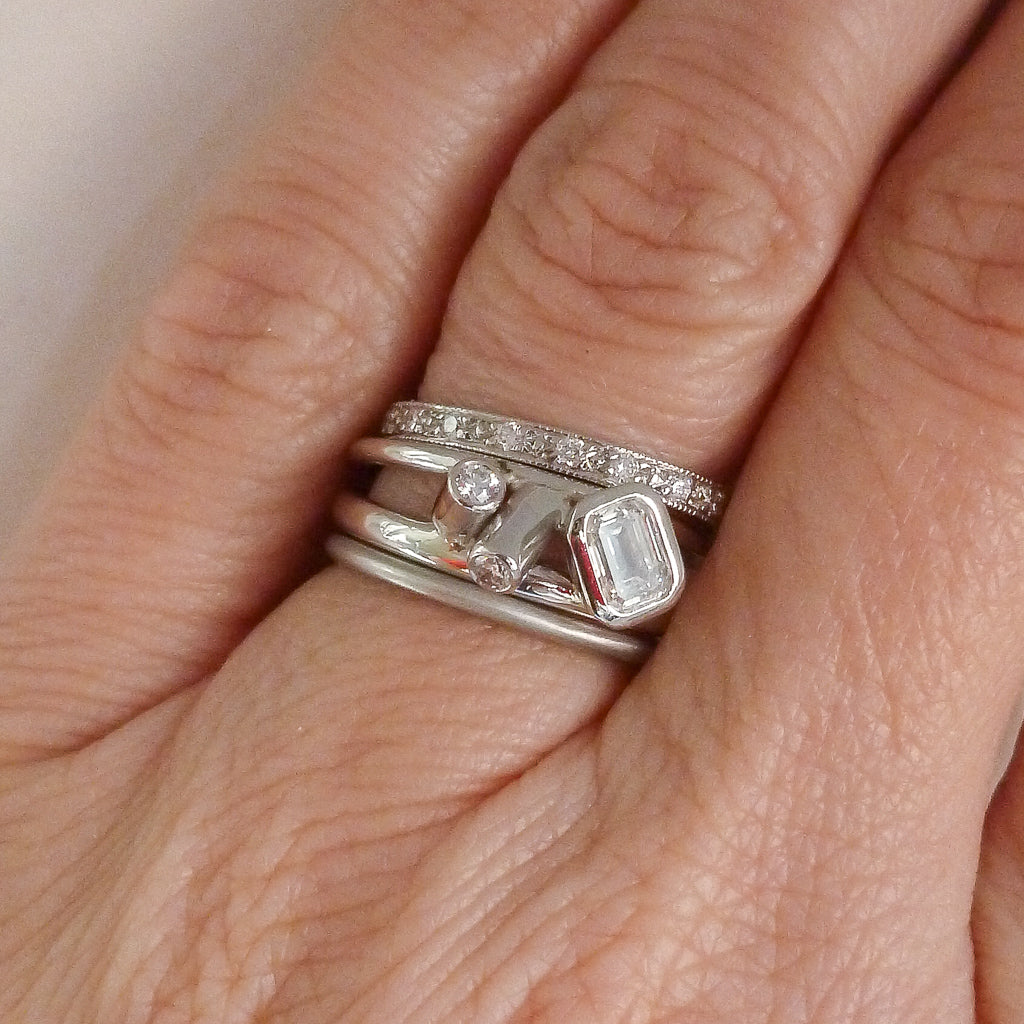 Modern two band platinum ring which can symbolise linking together in relationship