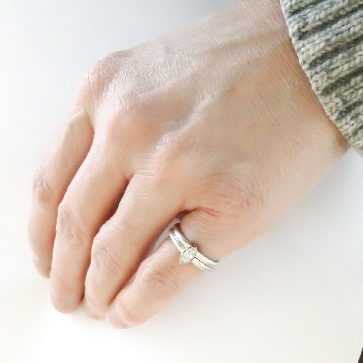 Contemporary unique and modern two band silver and gold marquise diamond stacking ring handmade Sue Lane jewellery. Perfect wedding and engagement ring.