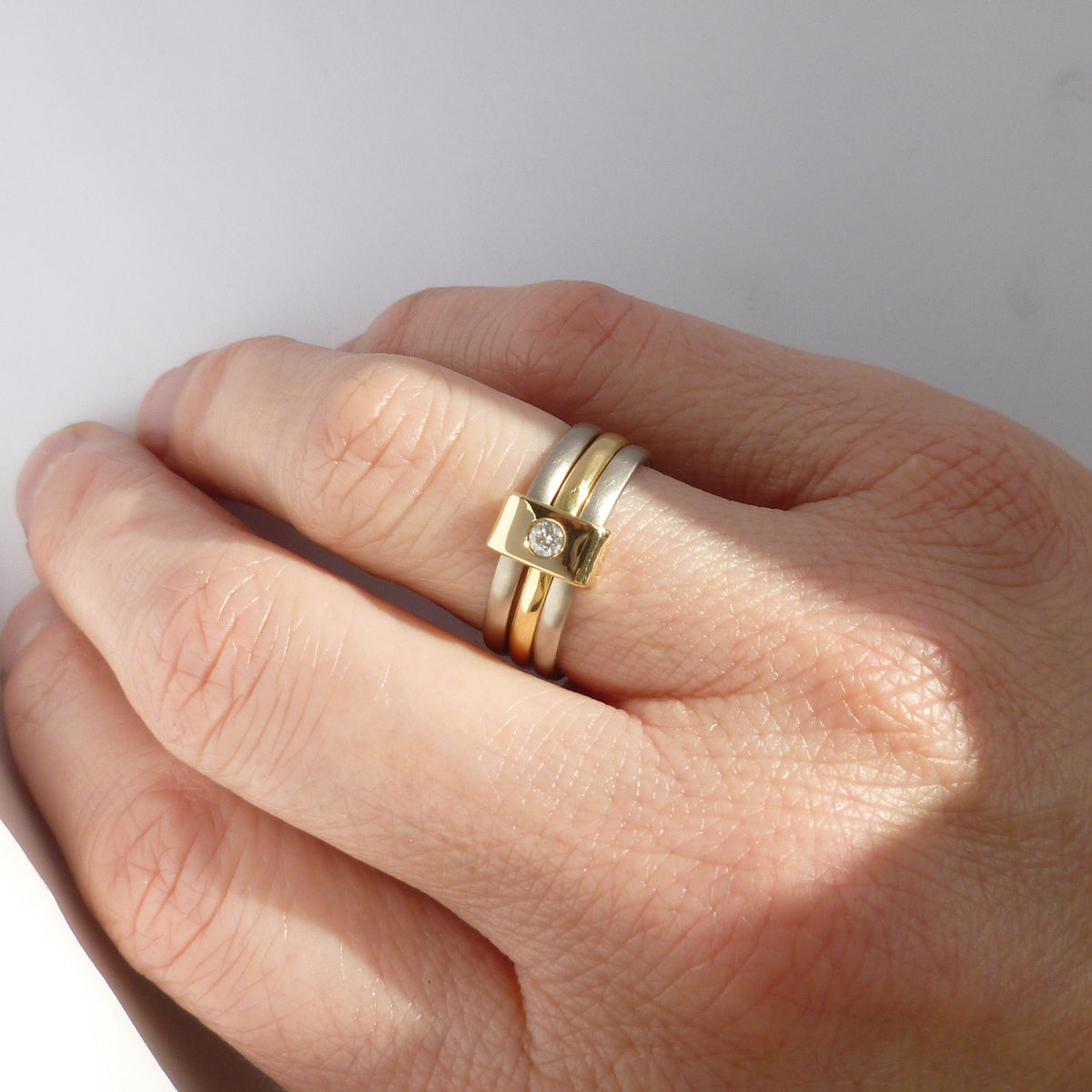 Contemporary jewellery, handmade, modern, bespoke ring by Sue Lane. Triple band ring, interlocking and linked.