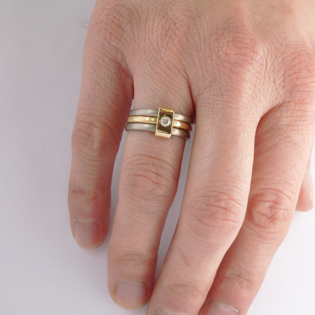 Contemporary jewellery, handmade, modern, bespoke ring by Sue Lane. Triple band ring, interlocking and linked.