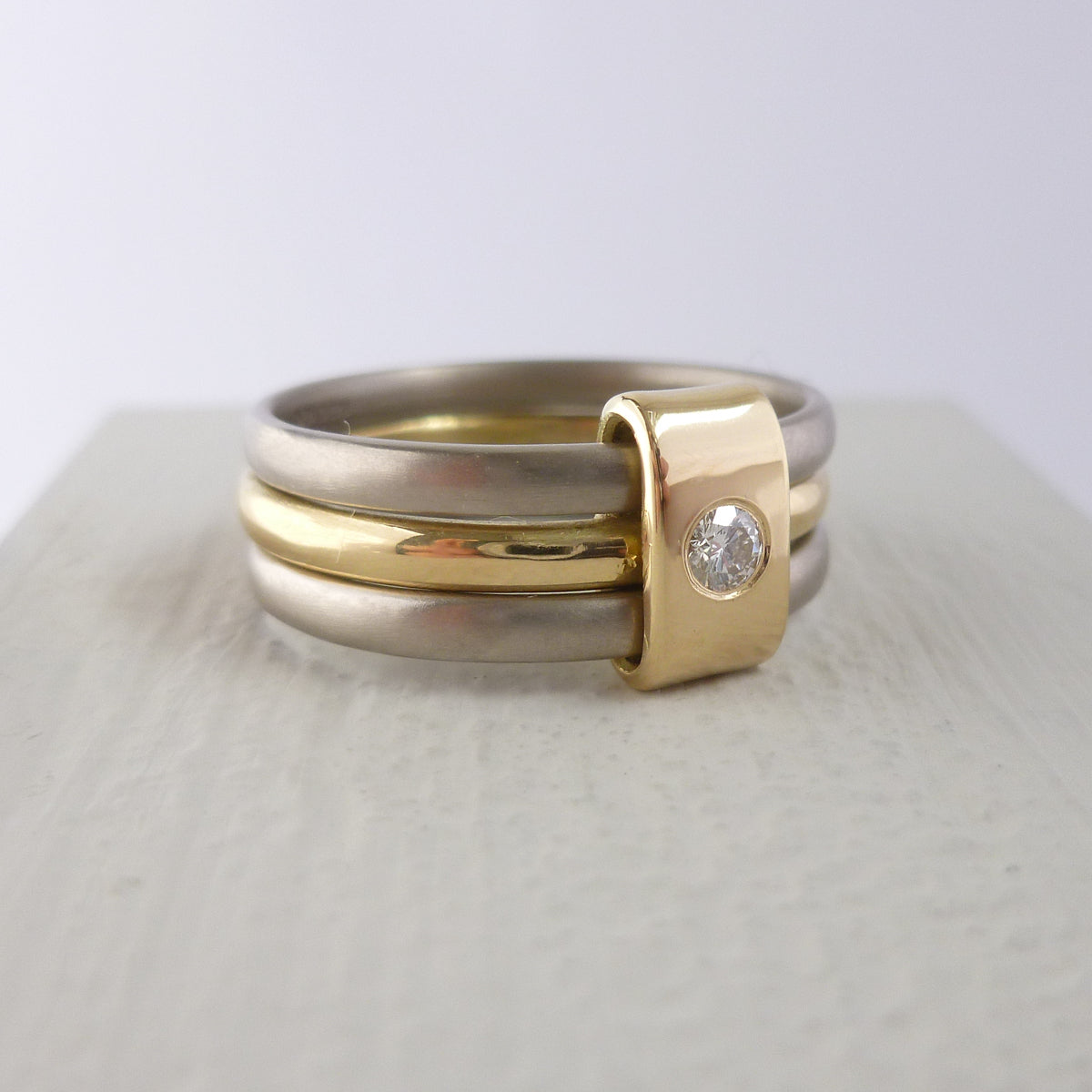 Contemporary jewellery, handmade, modern, bespoke ring by Sue Lane. Triple band ring, interlocking and linked.